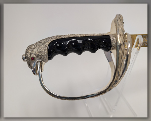 Close up showing ornate details on the pommel & hilt.