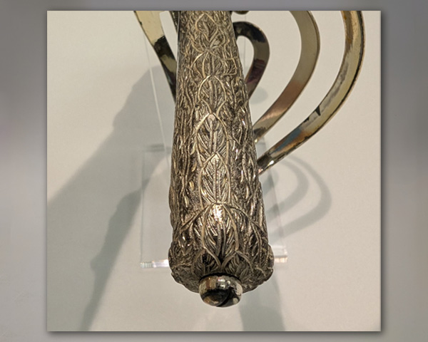 Feathering detail on top of hilt